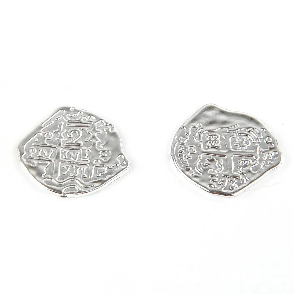 Doli set of 100 plastic Roman pirate coins in bronze, gold, and silver electroplated finishes.