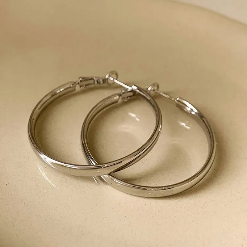 40mm diameter metal circle earrings in electroplated copper with gold and silver colour options