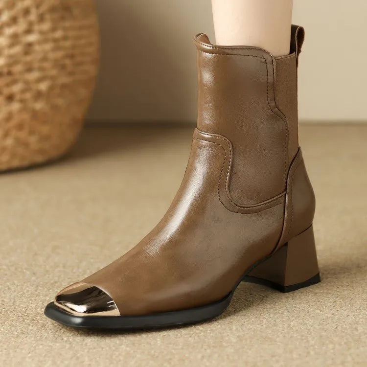 Brown women's cowhide Martin ankle boots with a high heel and side zipper on a white background.