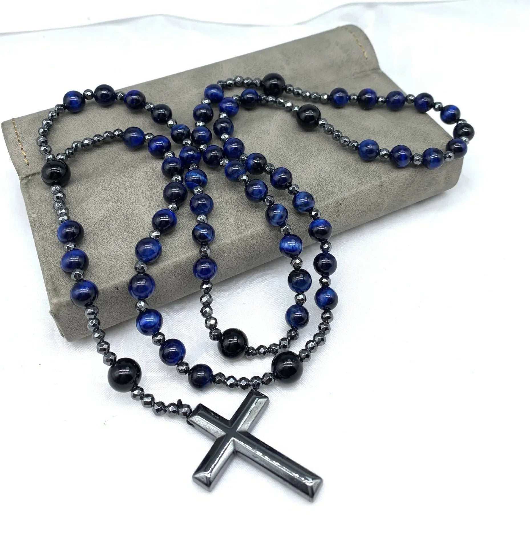 Men's stone cross pendant necklace on a ball bead chain with a safety lock clasp.