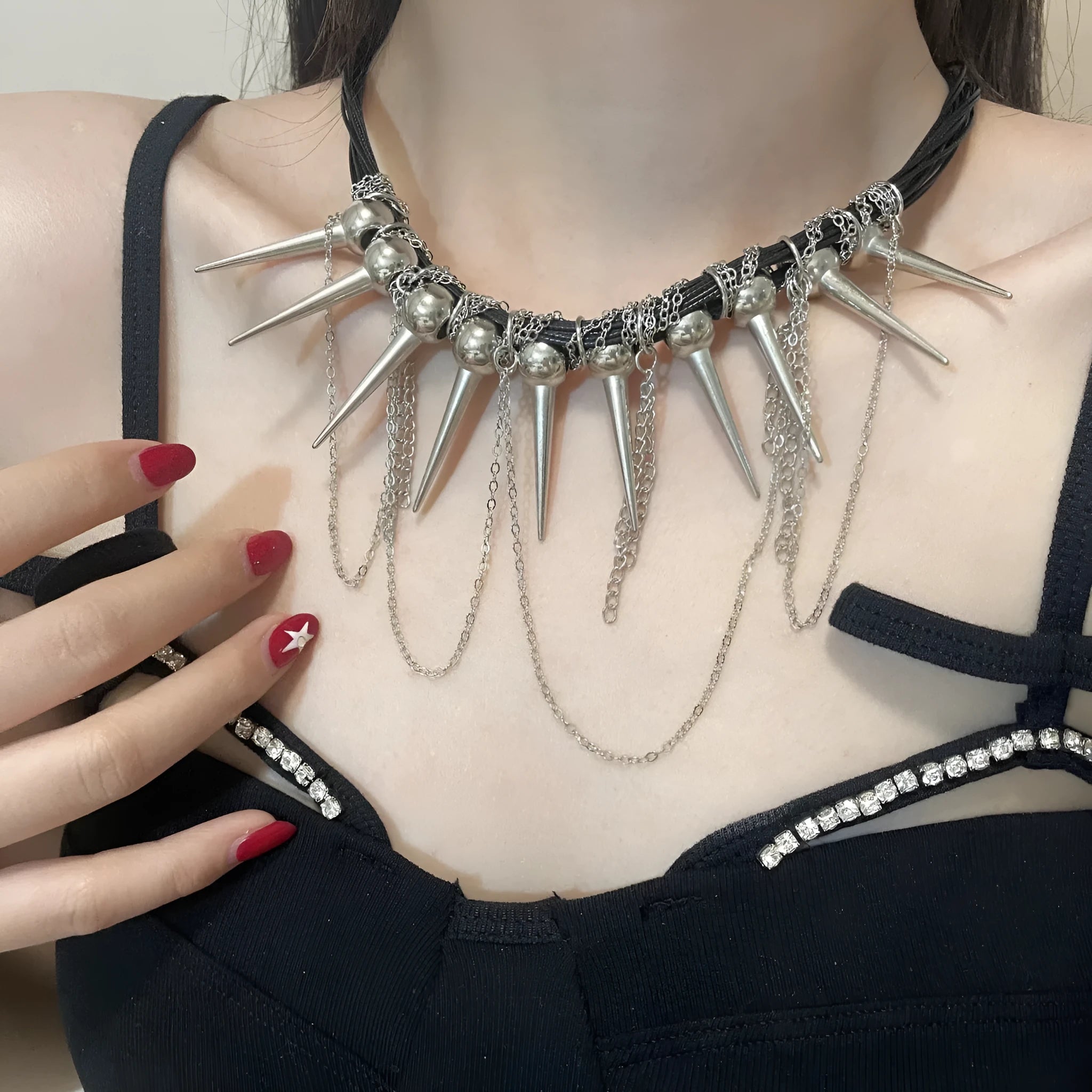 Women's leather necklace with electroplated round beads and a tassel drop in a casual, winding design.