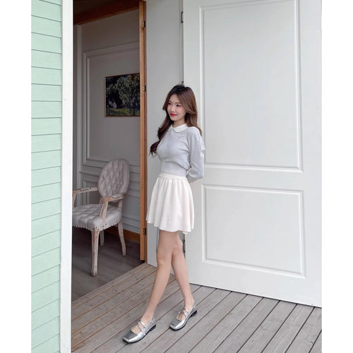 Women's silver ballet slipper pumps with a cross buckle strap, made from sheepskin leather with a flat heel.
