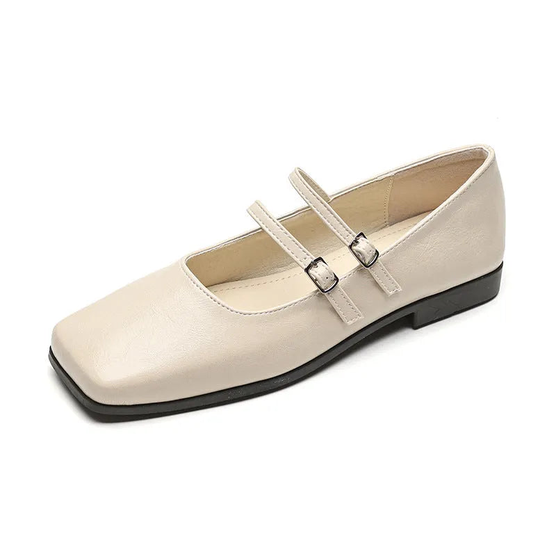 Women's silver ballet slipper pumps with a cross buckle strap, made from sheepskin leather with a flat heel.