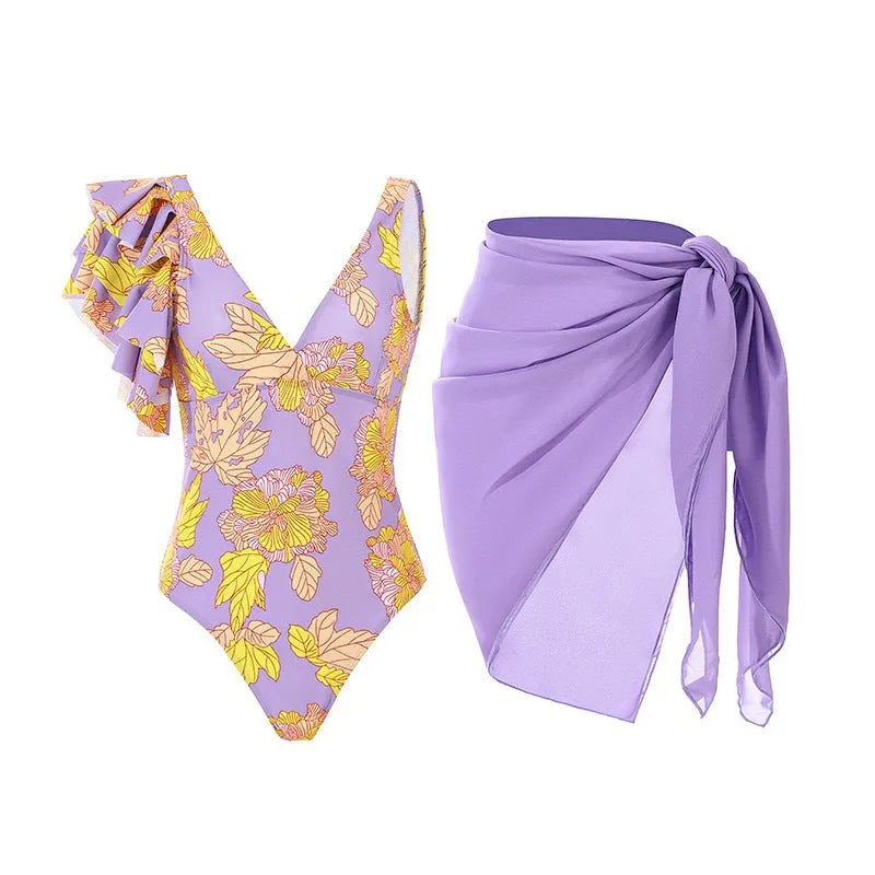 Women's solid colour one-piece swimsuit with spaghetti straps and a removable matching skirt.