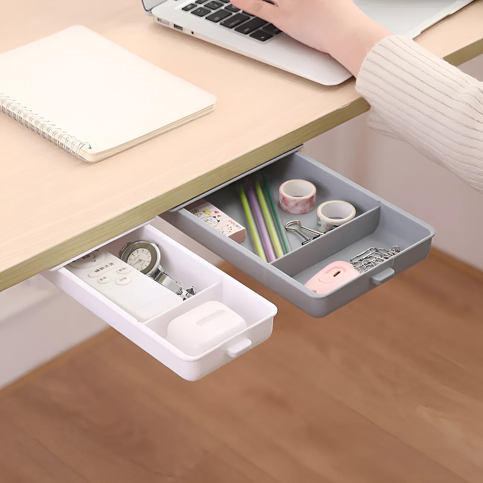 White plastic adhesive storage drawer with a covered grid design, shown mounted under a wooden desk.