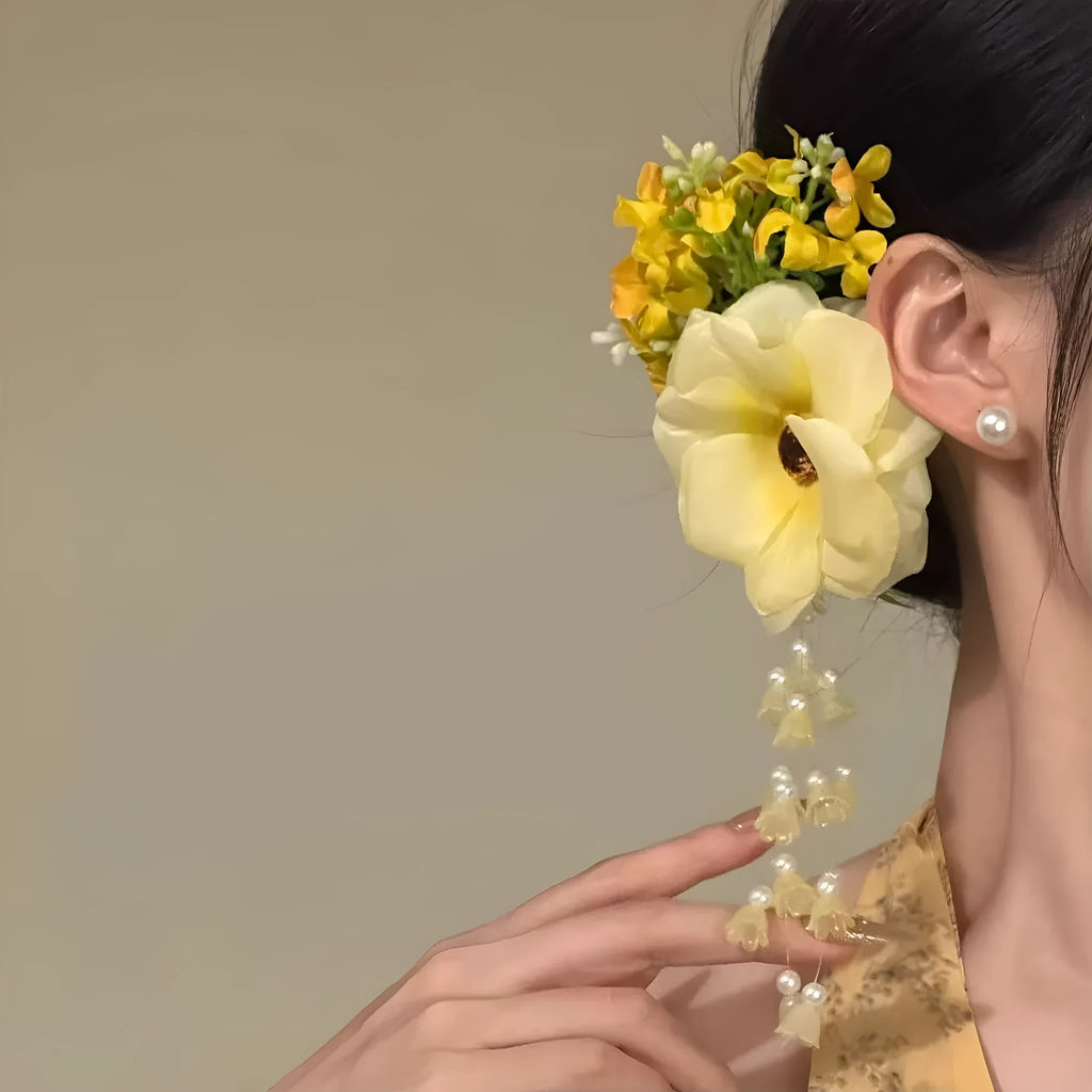 Yellow flower tassel hair clip side accessory with mixed material construction