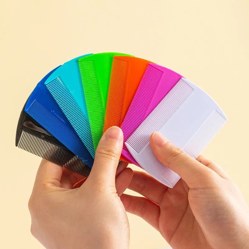 Double-edged fine-toothed plastic flea and lice comb in assorted colours on a white background.