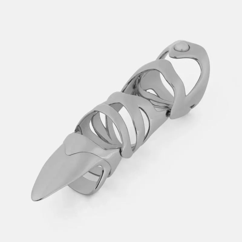 Silver colour alloy metal punk armour finger stall ring on a finger.