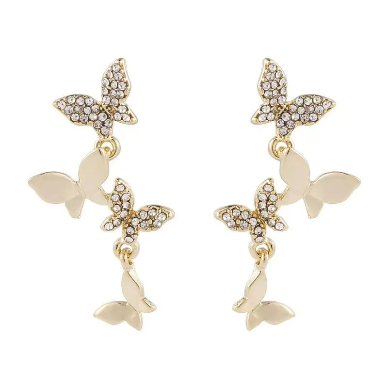 Gold-coloured copper earrings with butterfly design in ear drop style for women