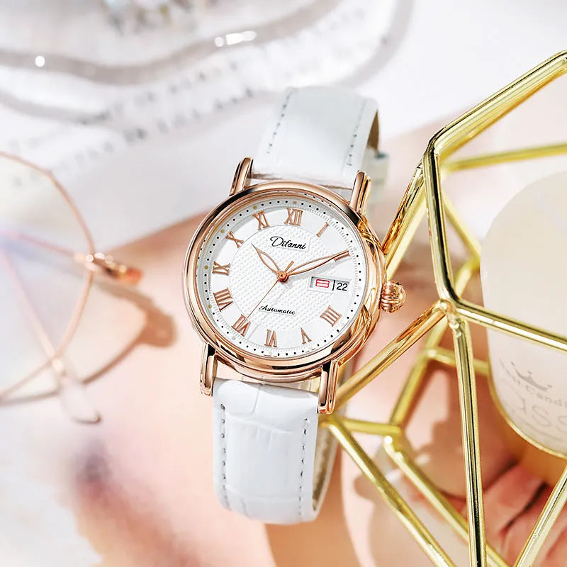 Women's automatic mechanical watch on wrist showing open case back with visible movement