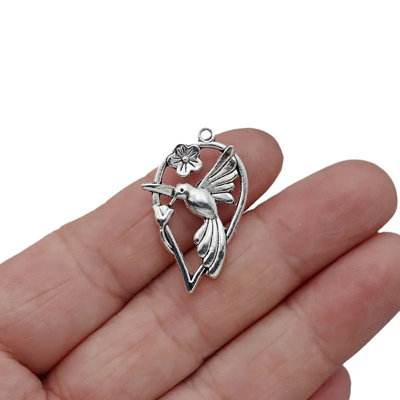 Alloy cuckoo bird pendant charm with electroplated gold tone finish for DIY jewellery making
