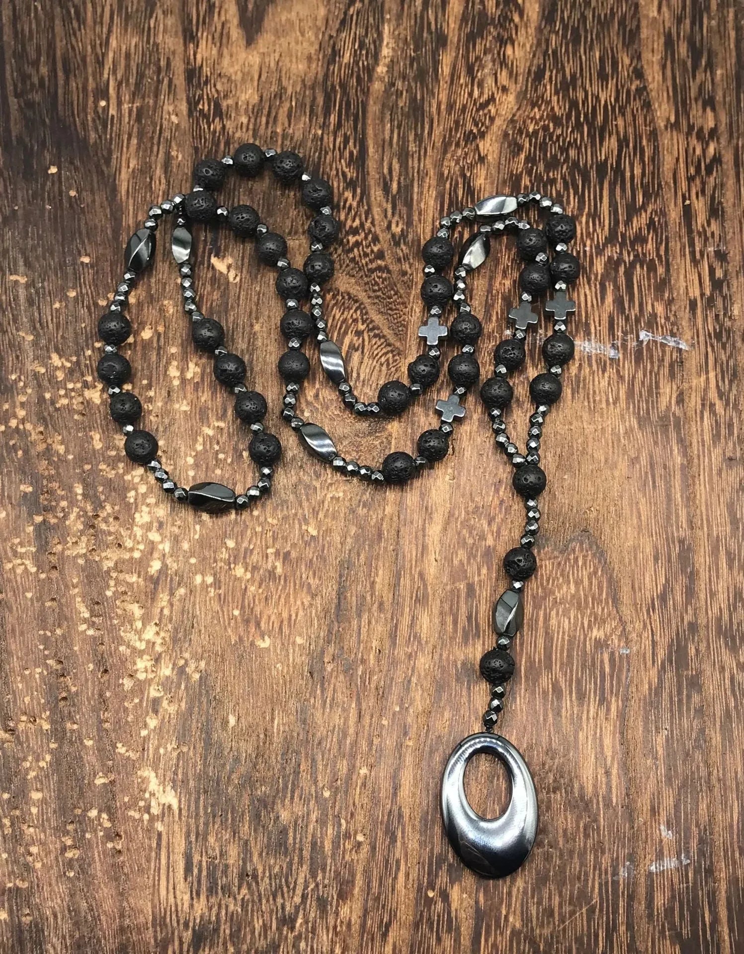 Men's stone cross pendant necklace on a ball bead chain with a safety lock clasp.