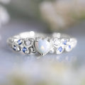 Women's heart-shaped ring with flower opal ocean design in peach colour on alloy band