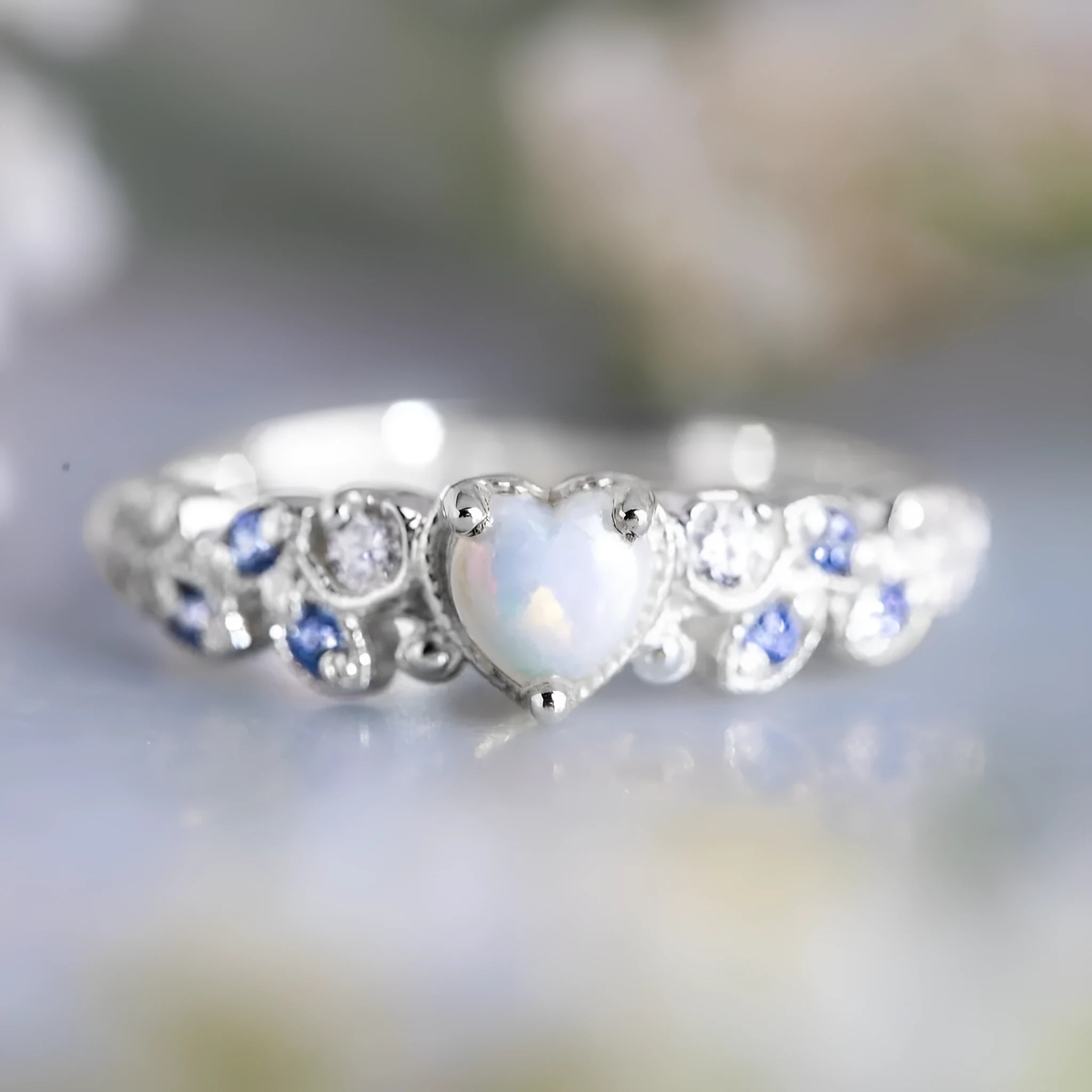 Women's heart-shaped ring with flower opal ocean design in peach colour on alloy band