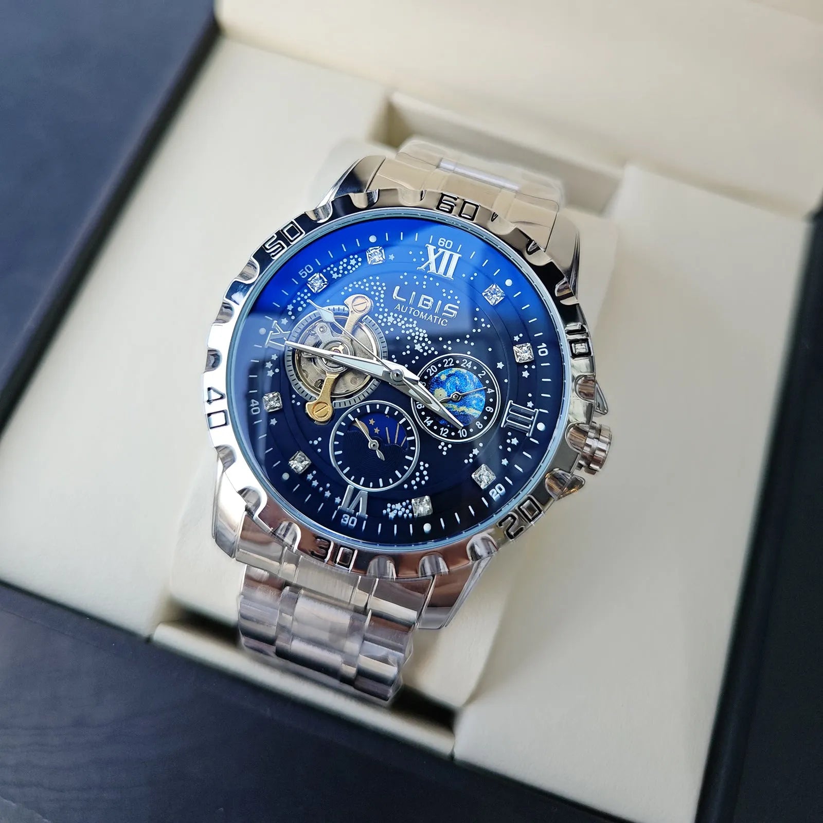 Men's silver automatic mechanical watch with black starry dial, luminous hands, and a leather strap.