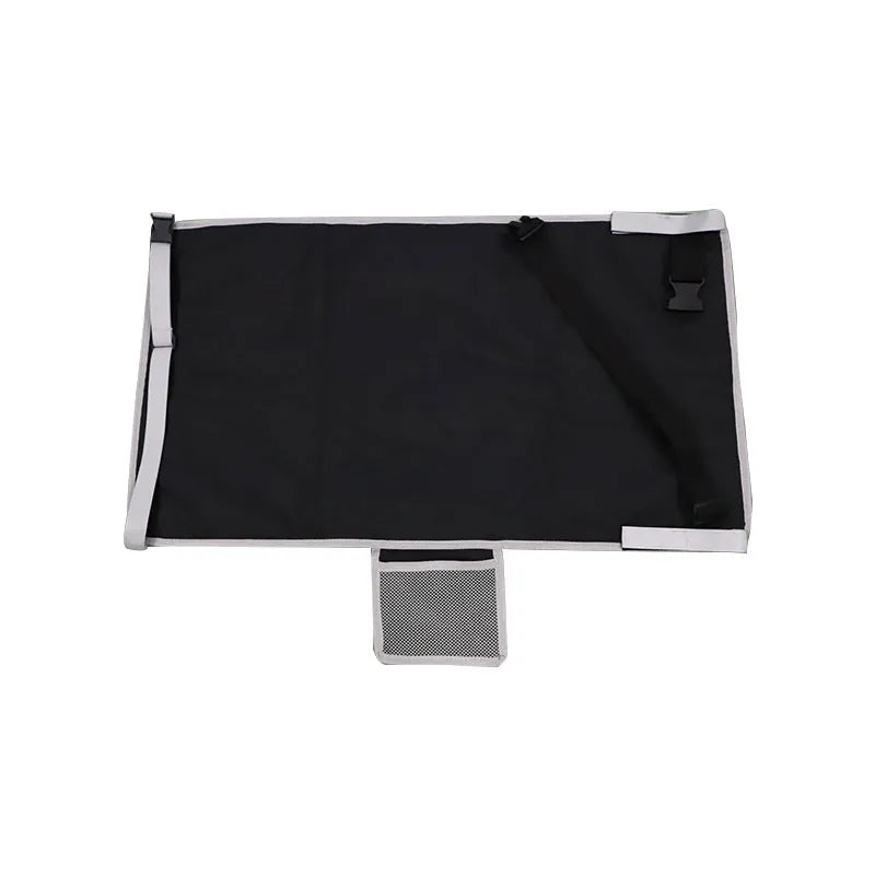Portable grey nylon children's aircraft seat pedal extender with a matching drawstring pocket.