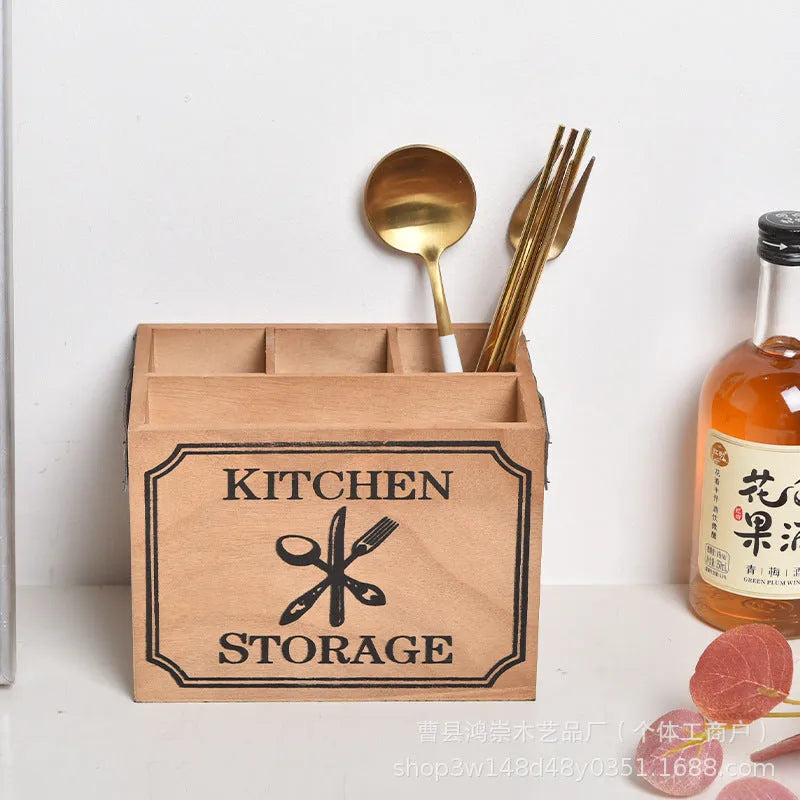 Natural wooden kitchen storage box with internal grid dividers for organising knives, forks, and chopsticks.