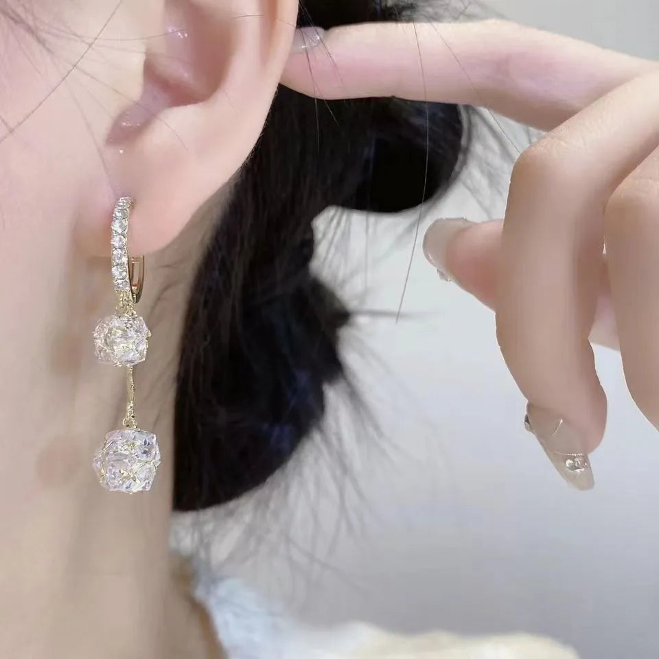 Silver confession balloon drop earrings with rhinestone ball and tassel pendant details and clip fastening