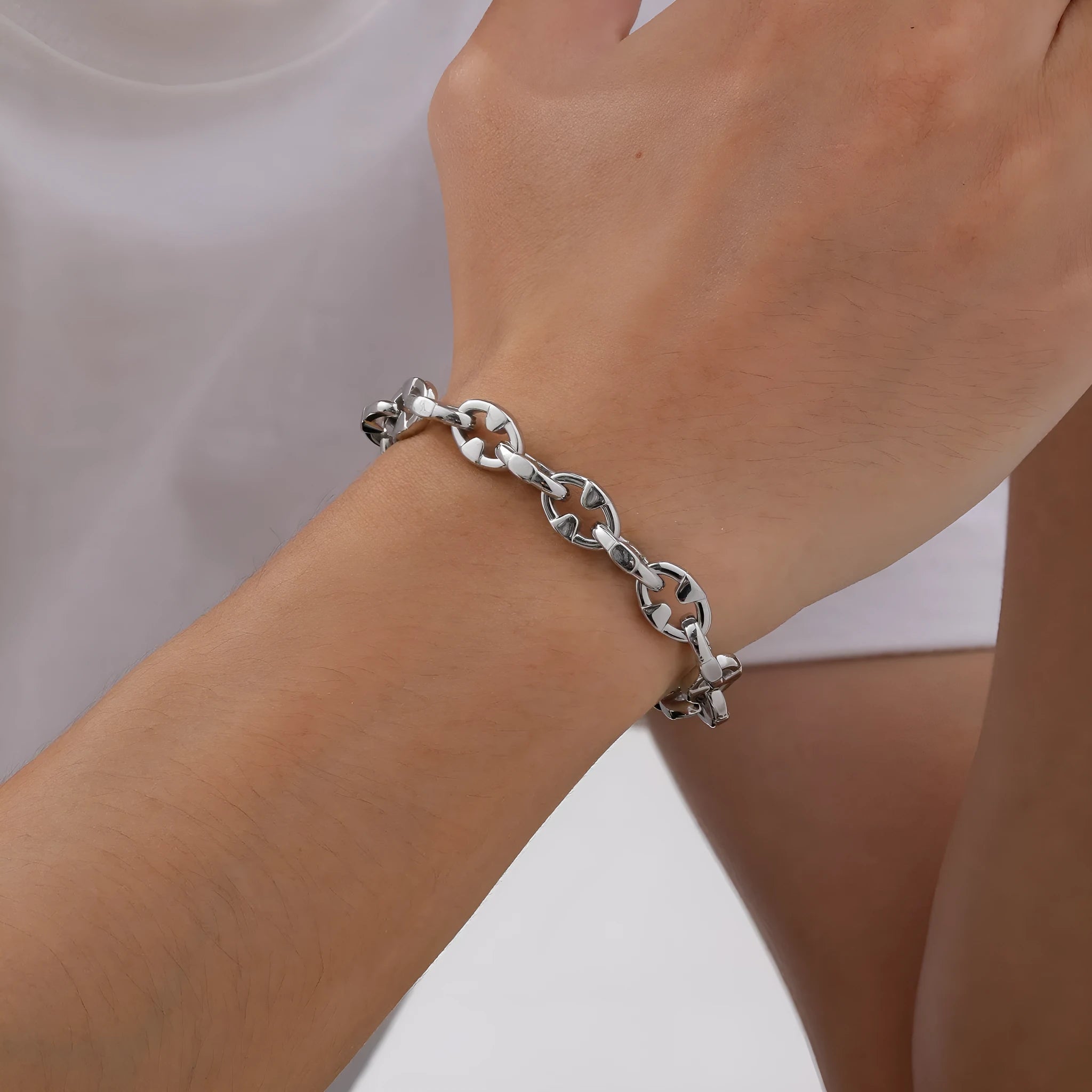 A thick geometric chain bracelet made of stainless steel, shown in a steel colour finish.