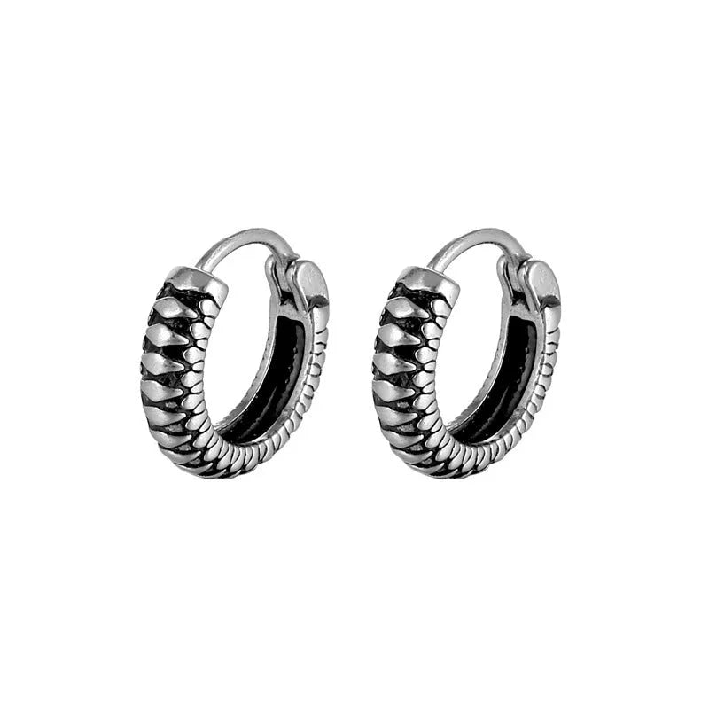 Silver geometric earrings with retro twist design and striped detailing on circular stainless steel form