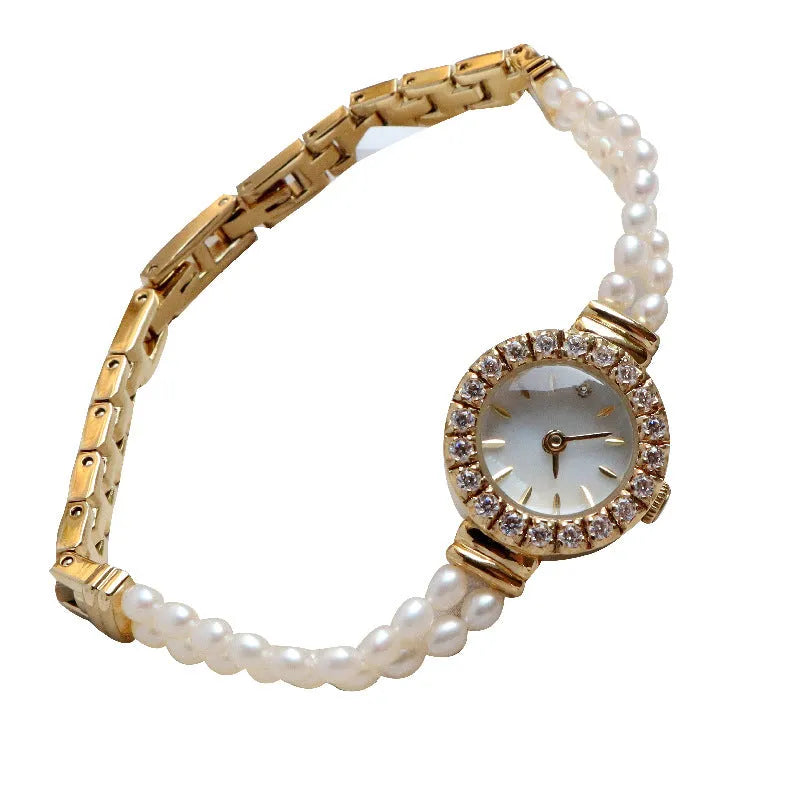 Women's light gold bracelet watch with freshwater pearl dial and stainless steel strap