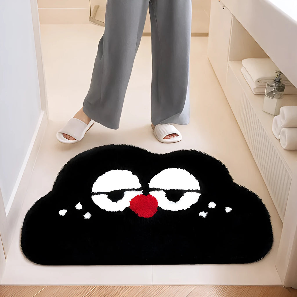 Colourful cartoon cloud bathroom mat with big eyes on a soft polyester pile.