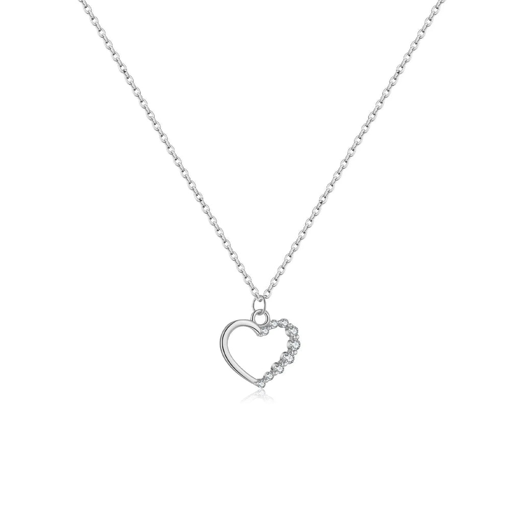 Close-up of a women's sterling silver hollow heart necklace with a circle detail, showing the white gold finish option.