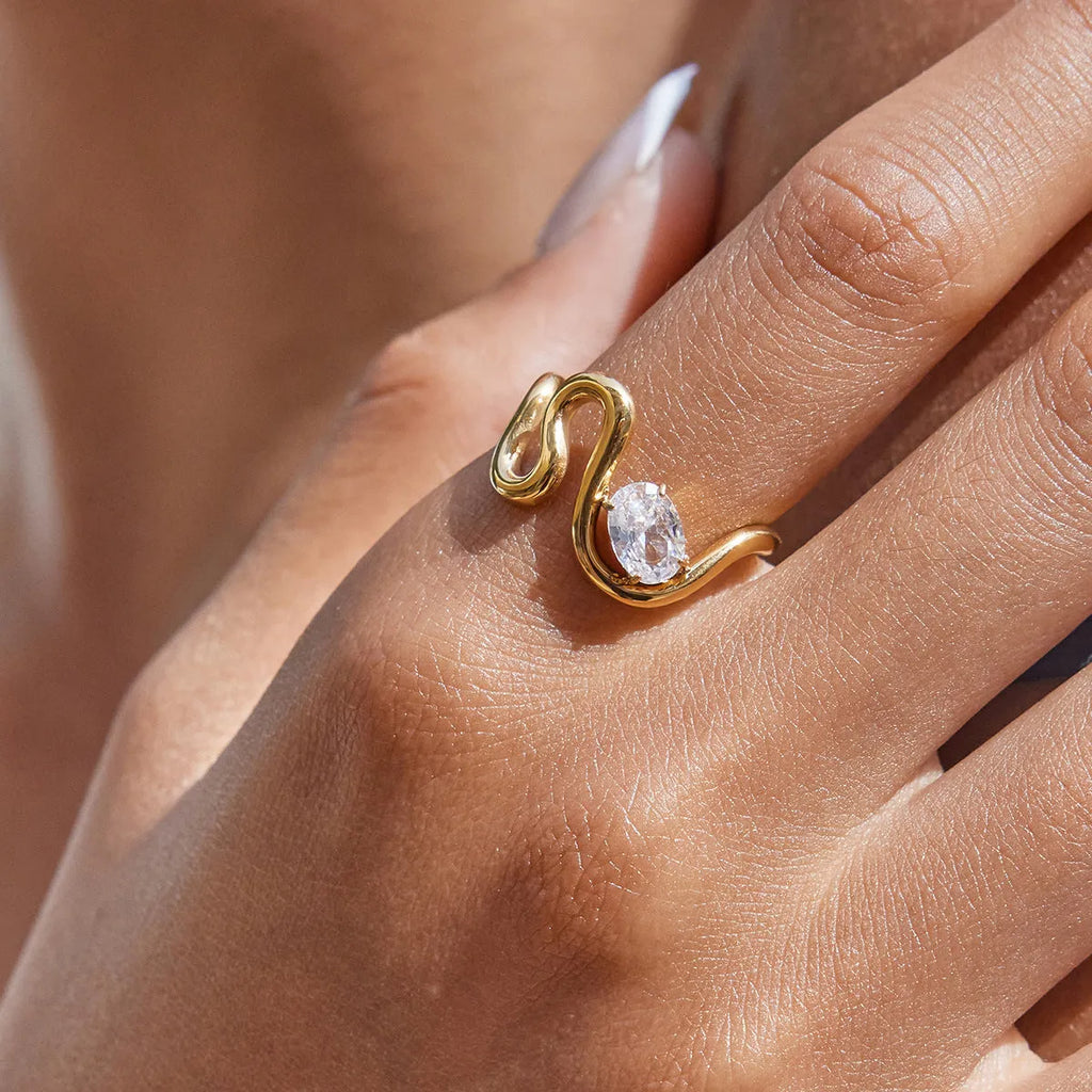 Geometric zircon ring in titanium steel with non-fading finish on a hand.