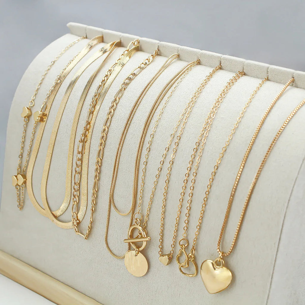 10-piece gold electroplated women's necklace set with snake bone chains and simple alloy pendants