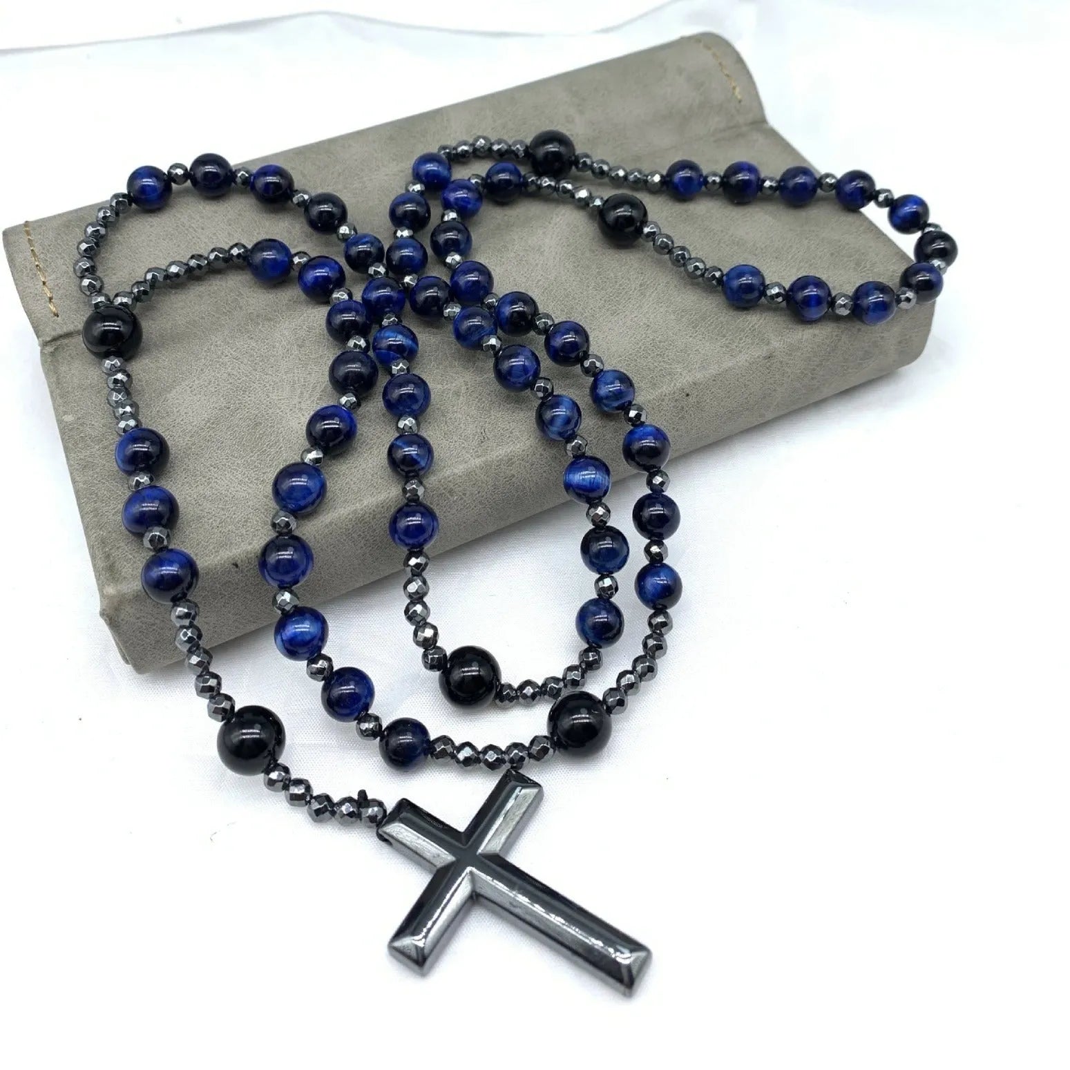 Men's stone cross pendant necklace on a ball bead chain with a safety lock clasp.