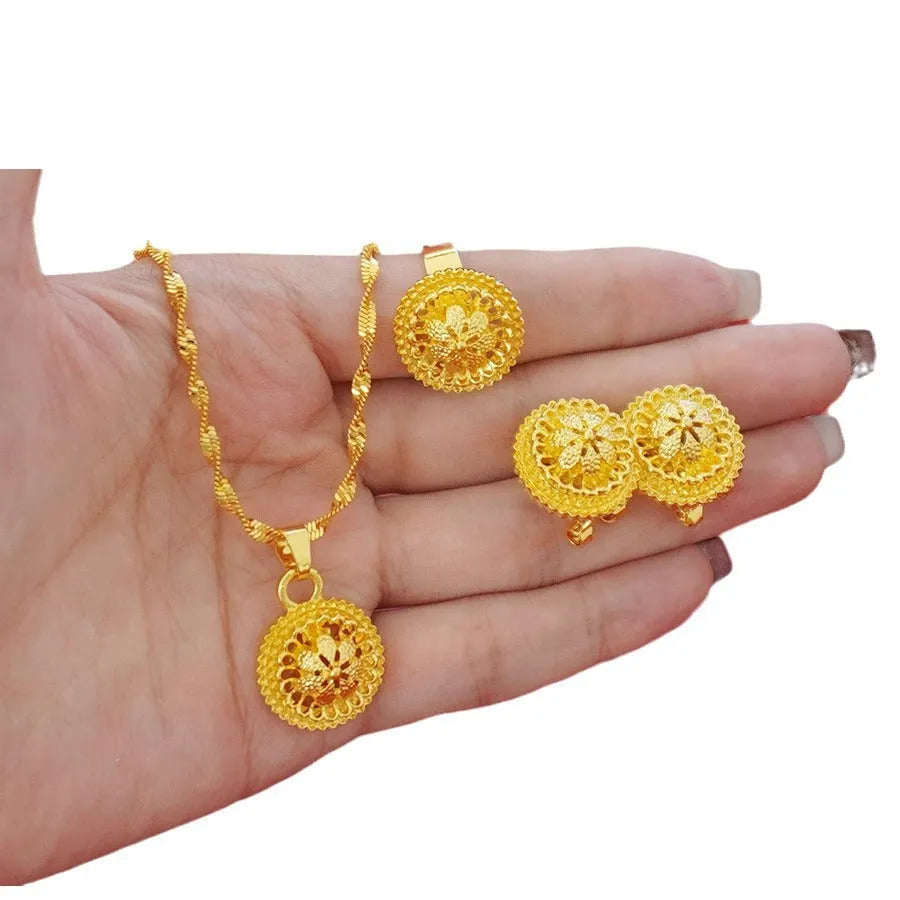 Three-piece gold electroplated jewellery set showing necklace with pendant, earrings, and matching ring