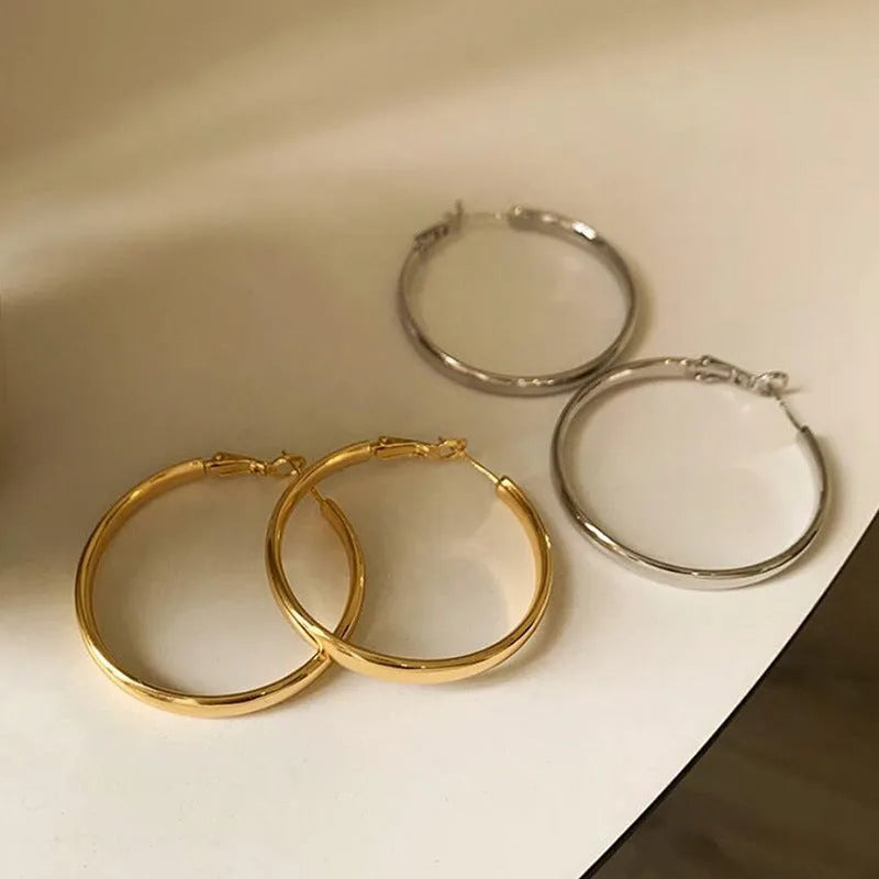 40mm diameter metal circle earrings in electroplated copper with gold and silver colour options