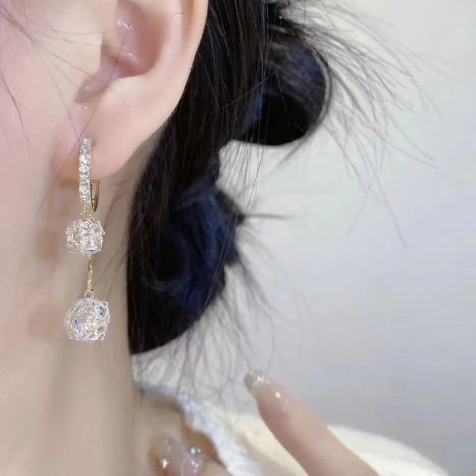 Silver confession balloon drop earrings with rhinestone ball and tassel pendant details and clip fastening