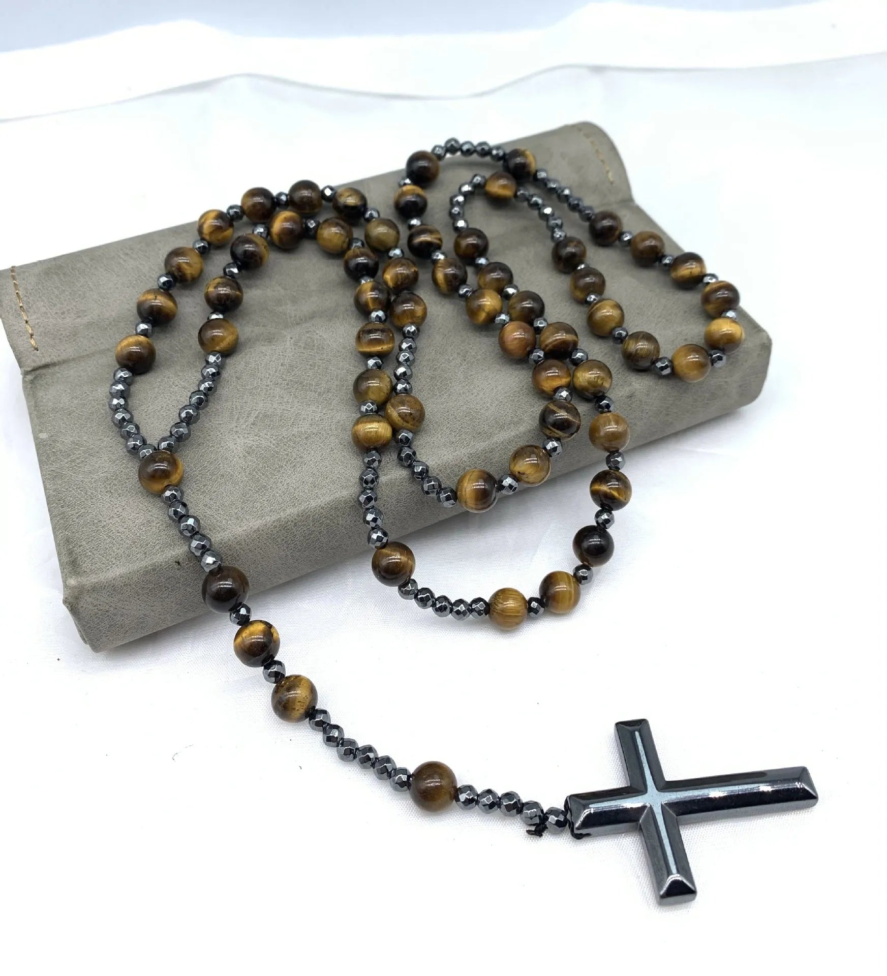 Men's stone cross pendant necklace on a ball bead chain with a safety lock clasp.