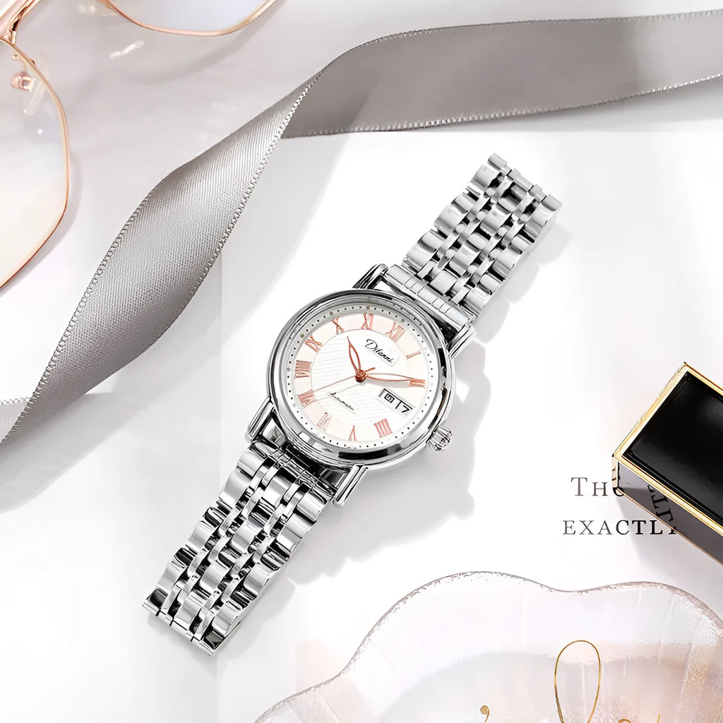 Women's automatic mechanical watch on wrist showing open case back with visible movement