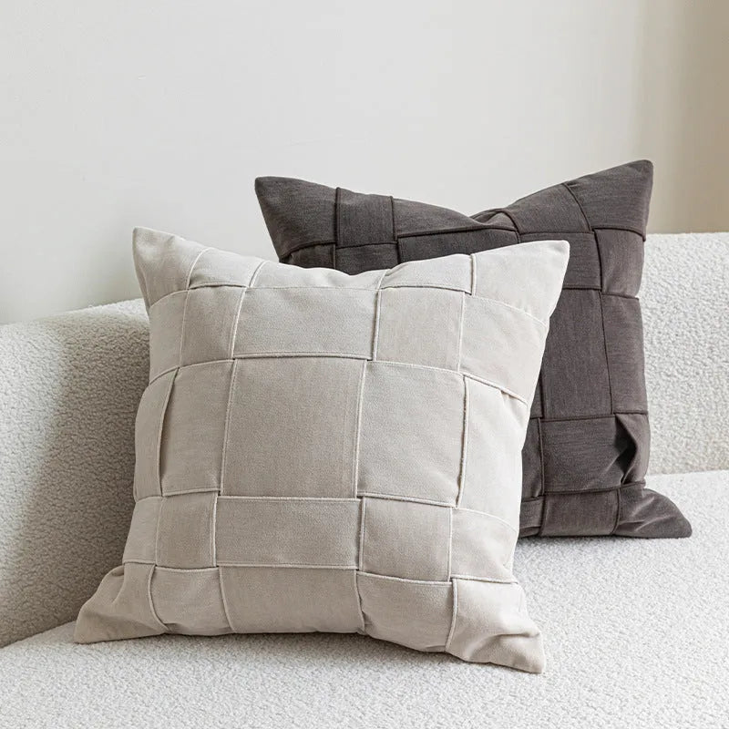 Chenille woven square pillow cushion in beige colour on a sofa