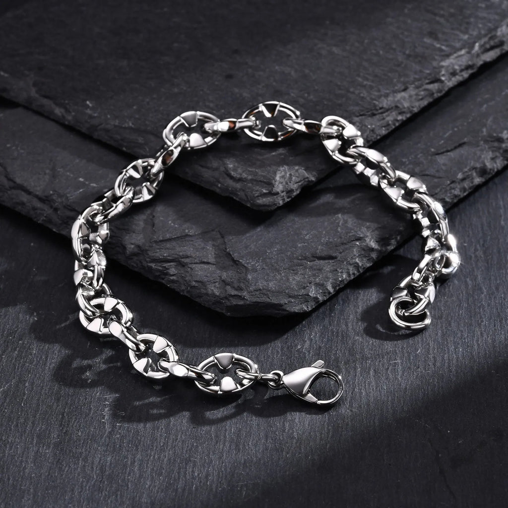 A thick geometric chain bracelet made of stainless steel, shown in a steel colour finish.