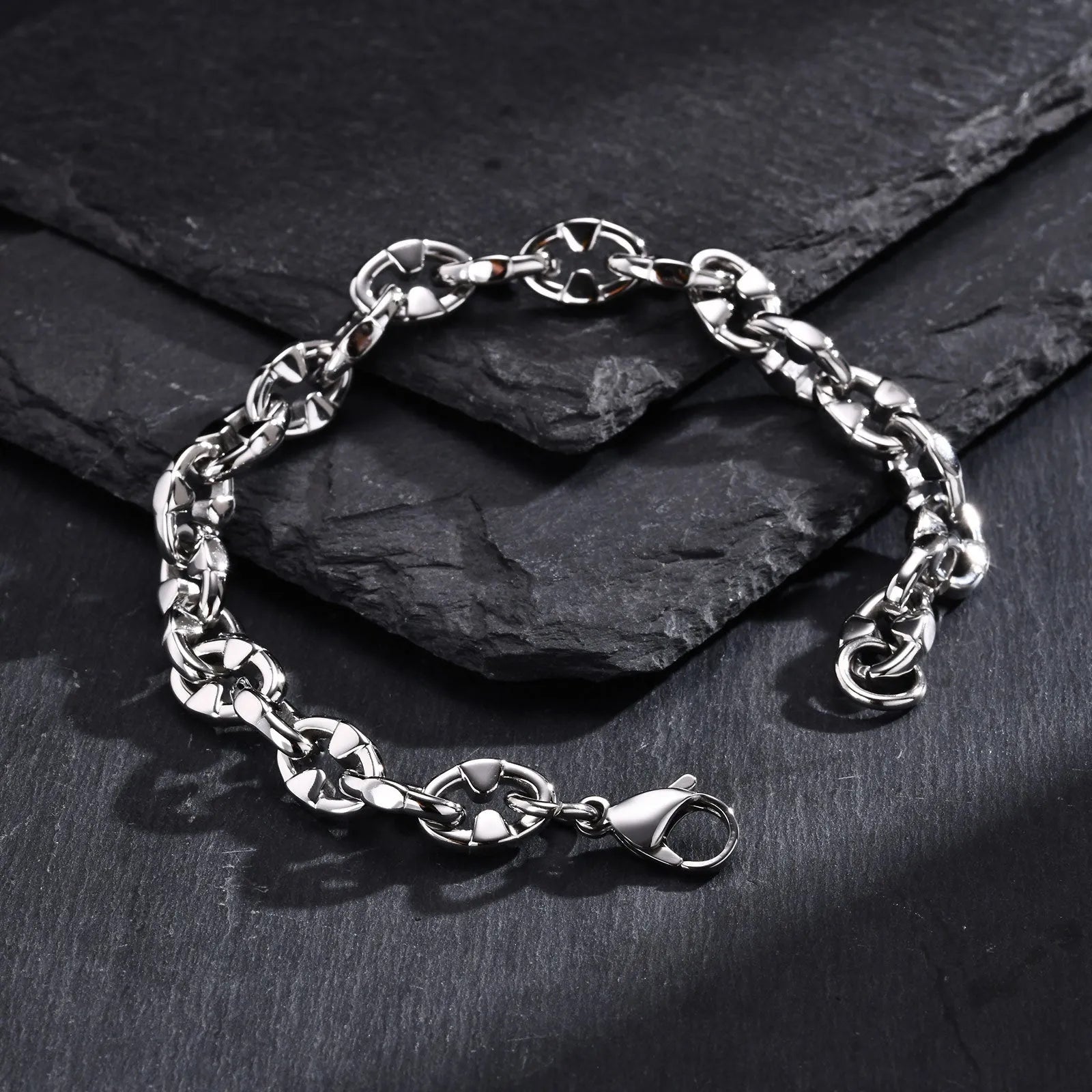 A thick geometric chain bracelet made of stainless steel, shown in a steel colour finish.