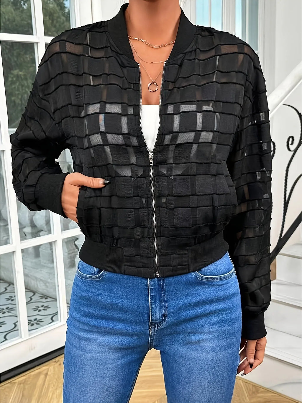 Black women's casual jacket with a geometric pattern, semi-transparent polyester fabric, and a thread zipper.