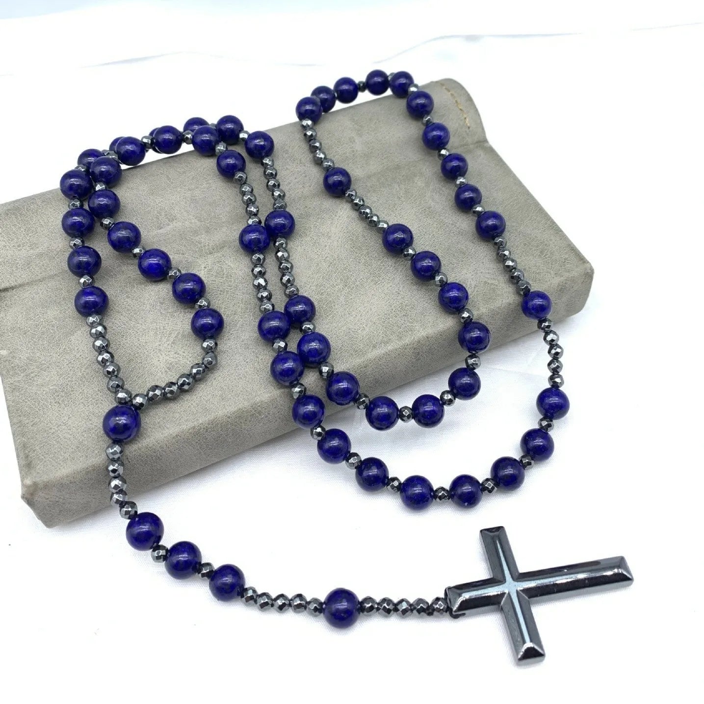 Men's stone cross pendant necklace on a ball bead chain with a safety lock clasp.
