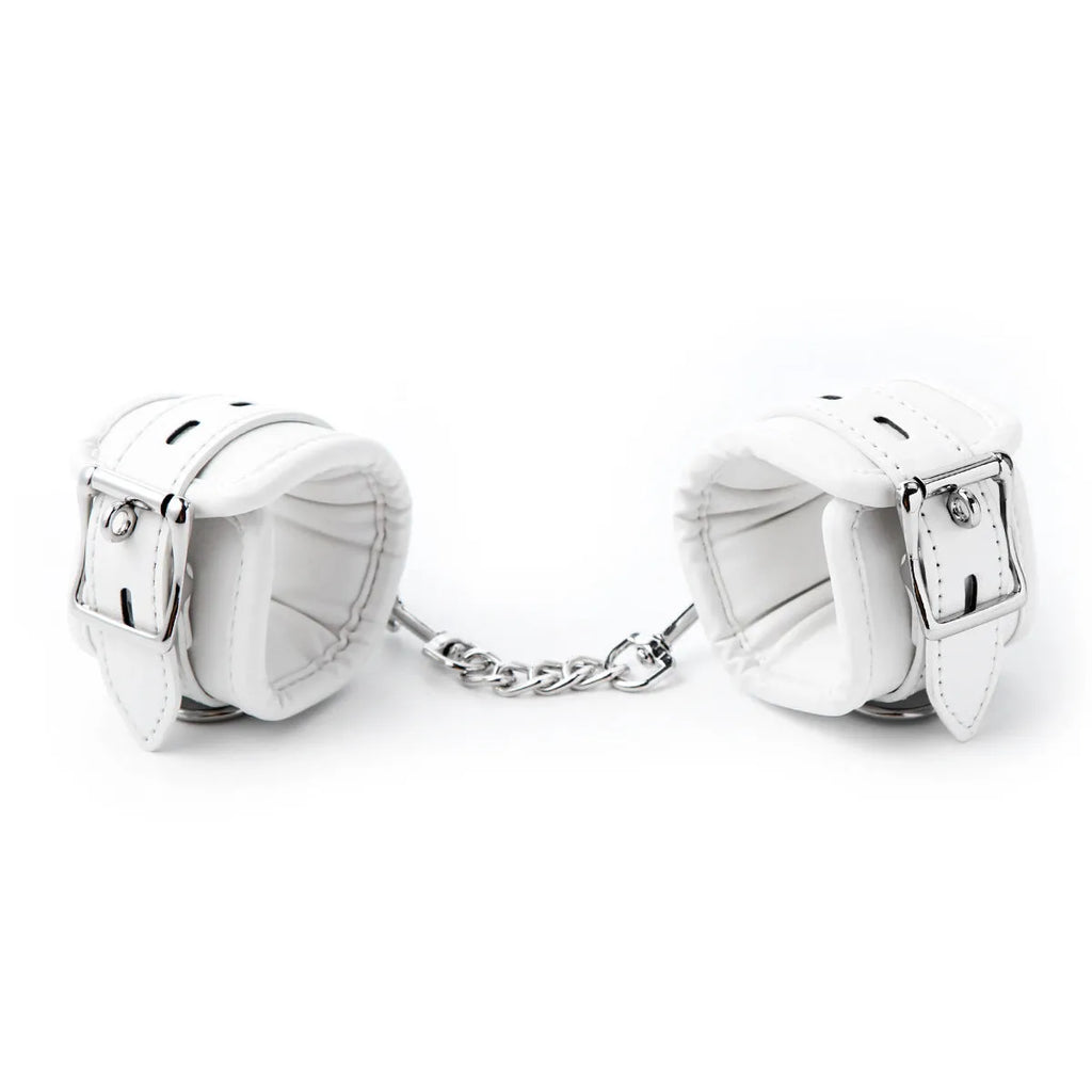 White PU sponge bondage restraint set showing handcuffs, foot cuffs and neck scarf for adjustable adult play
