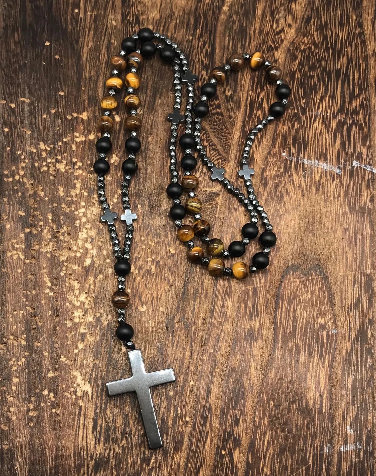 Men's stone cross pendant necklace on a ball bead chain with a safety lock clasp.
