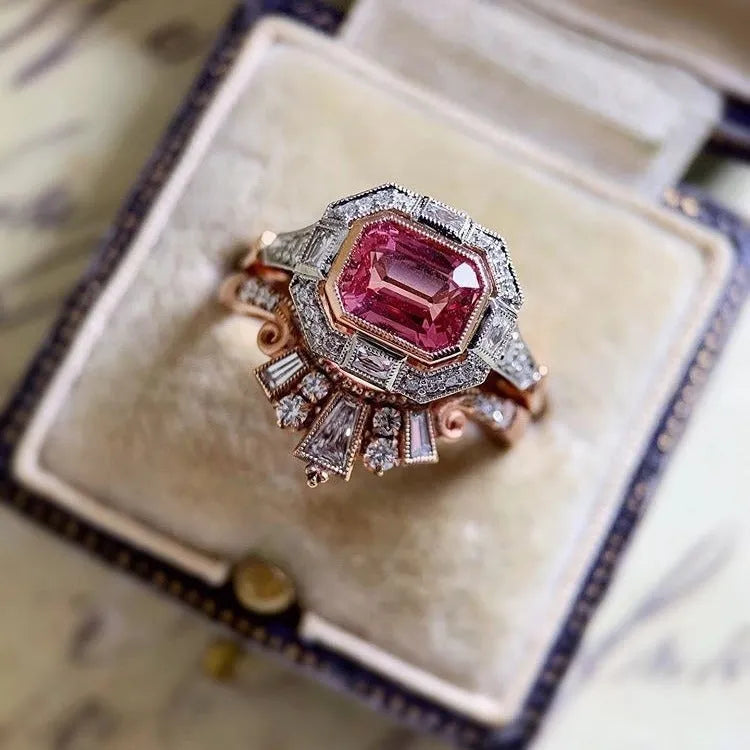 Women's retro style fashion ring with geometric design, rose gold finish and ruby detail
