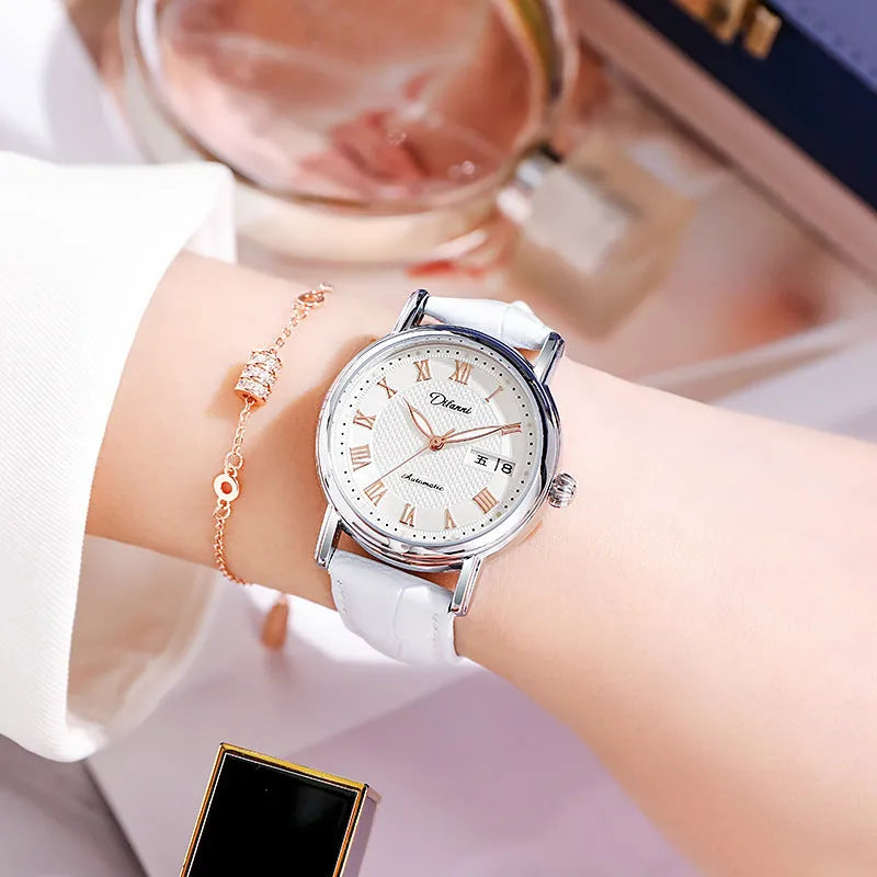 Women's automatic mechanical watch on wrist showing open case back with visible movement