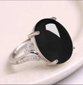 Geometric-style adjustable alloy ring in five colour options on a neutral background.
