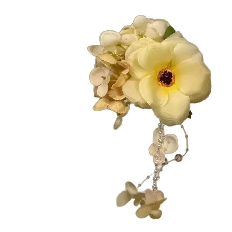Yellow flower tassel hair clip side accessory with mixed material construction