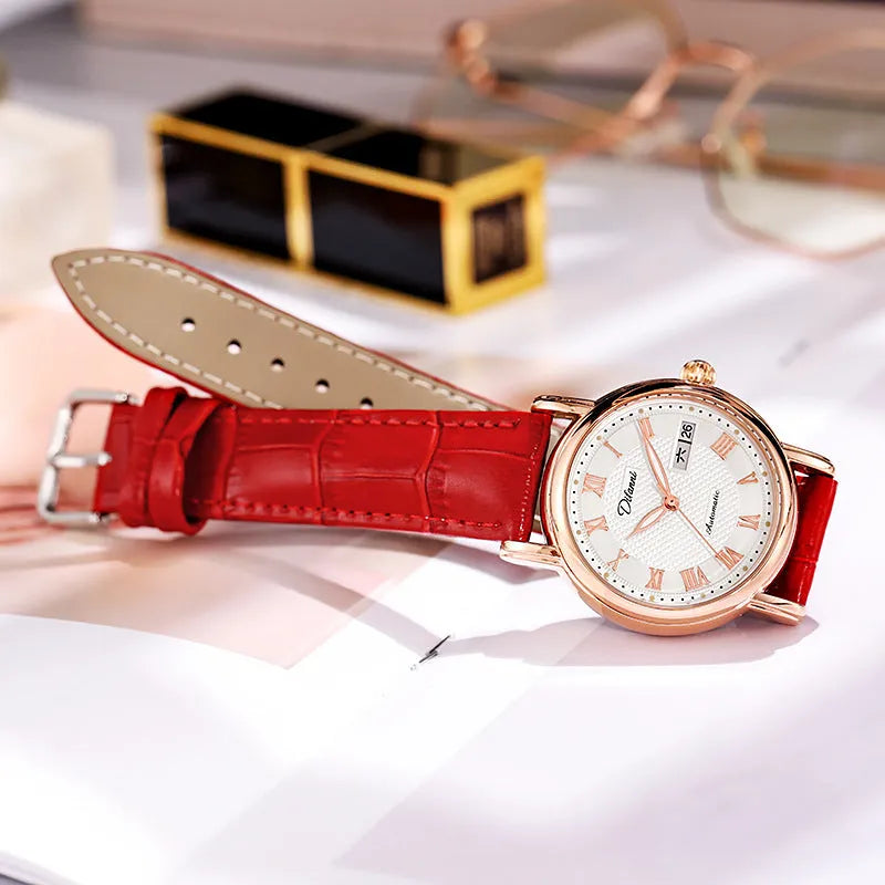 Women's automatic mechanical watch on wrist showing open case back with visible movement