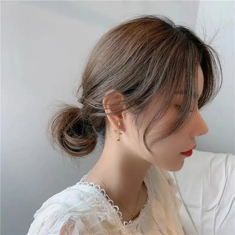 Gold-coloured copper earrings with butterfly design in ear drop style for women