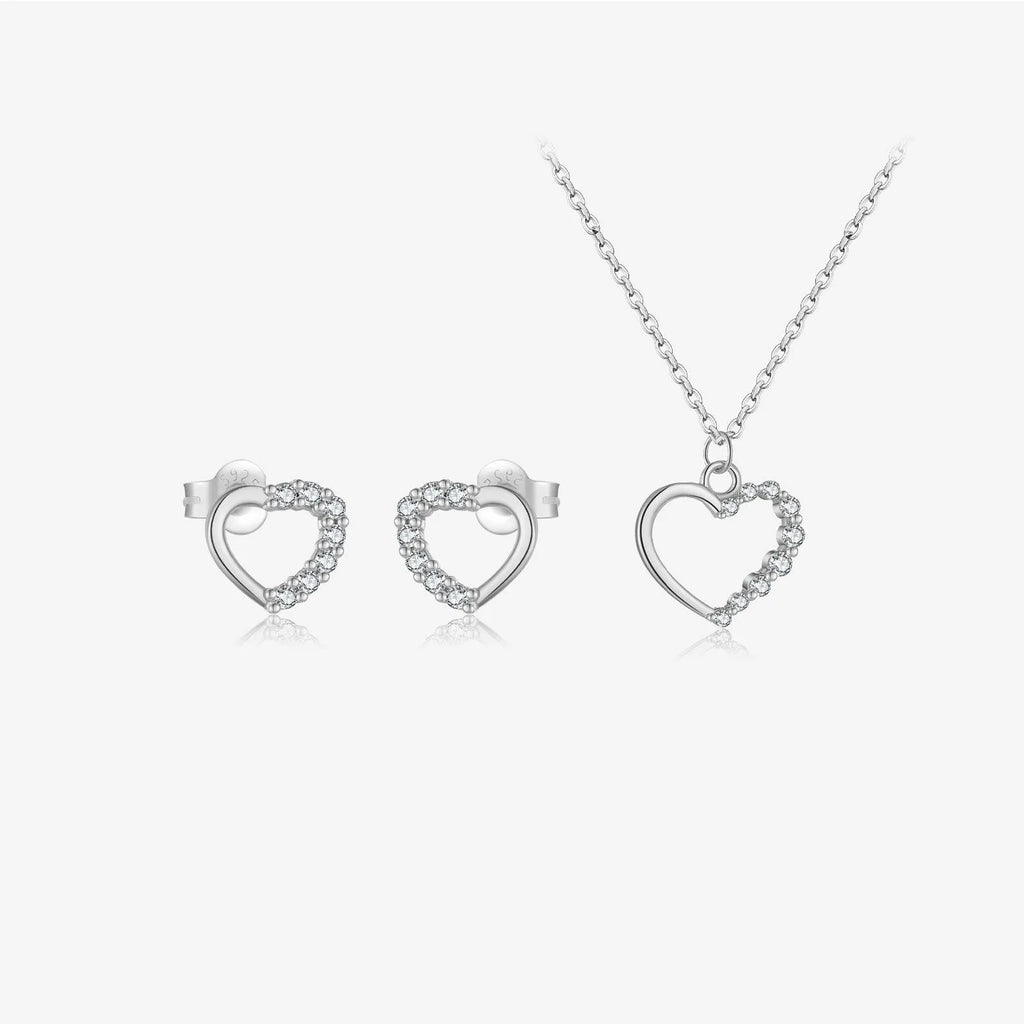 Close-up of a women's sterling silver hollow heart necklace with a circle detail, showing the white gold finish option.