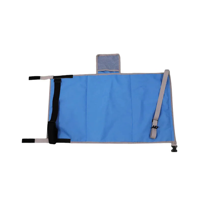 Portable grey nylon children's aircraft seat pedal extender with a matching drawstring pocket.